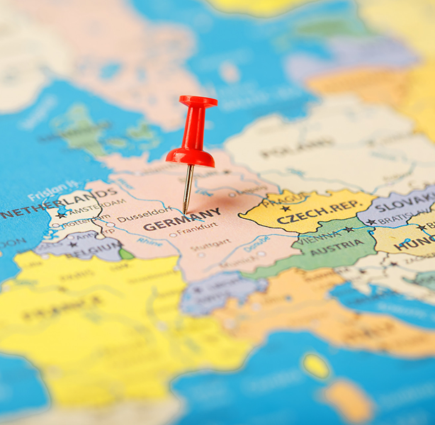 Student holding a globe, representing country-specific scholarships