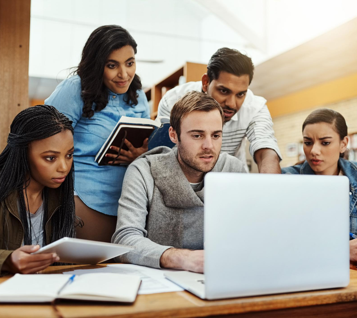 Learners working together on a laptop