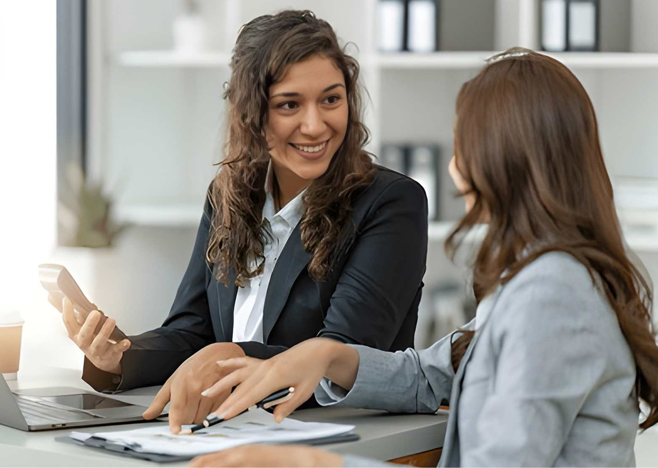 Two professionals in a modern office setting