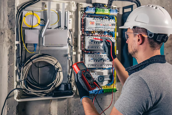 Electrical and instrumentation technician working on control systems
