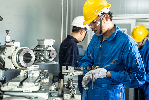 Mechanical discipline workers installing industrial equipment