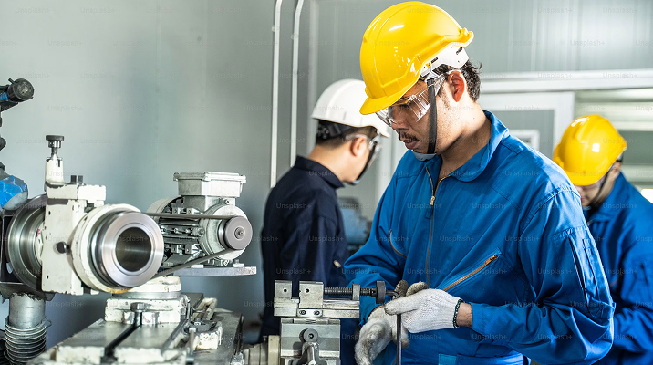 Mechanical discipline workers installing industrial equipment